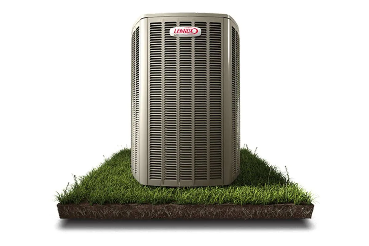 A high-quality heat pump from Lennox on the grass.